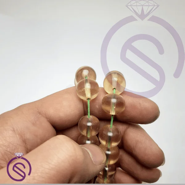تسبیح سندلوس 33 دانه عسلی شفاف